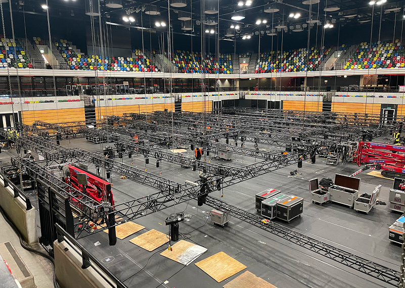 Event being set up with lighting rigs and crew working